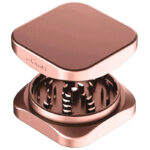 Rose gold Krush Kube 2.0 XL aluminium grinder opened to show its grinding teeth