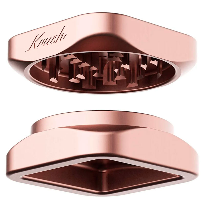 Separated view of the rose gold Krush Kube 2.0 XL showing both grinder sections and grinding teeth
