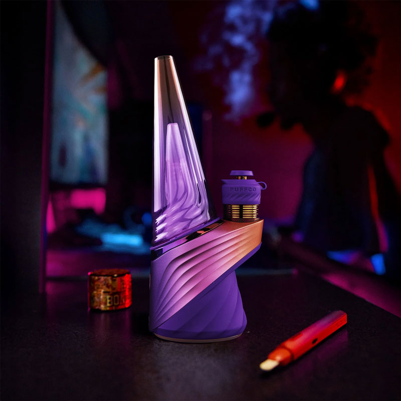 Peak Pro Plasma placed upright in a dark room with pink and purple lighting