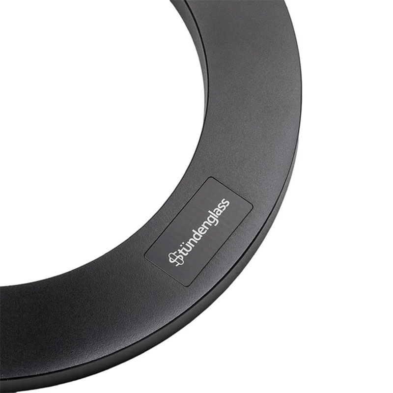 Close view of the Stündenglass logo on the black circular stand