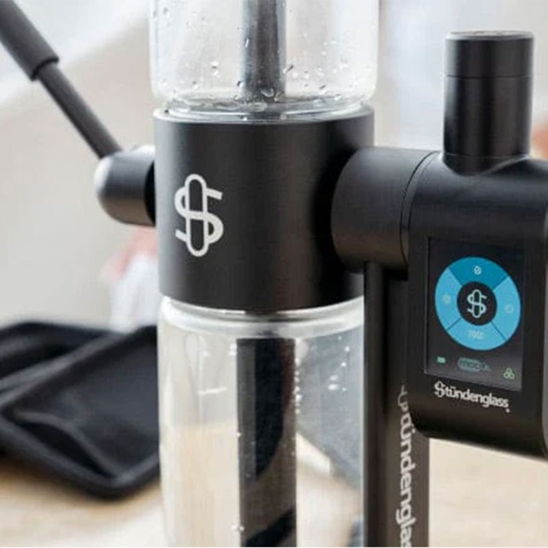 Close view of the black Stündenglass Gravity Infuser with digital control attachment