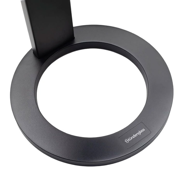Close view of the circular black Stündenglass stand