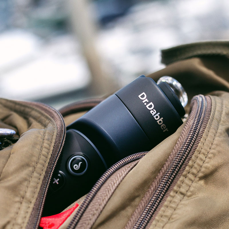 Dr. Dabber Switch GO packed inside a travel bag for portable use