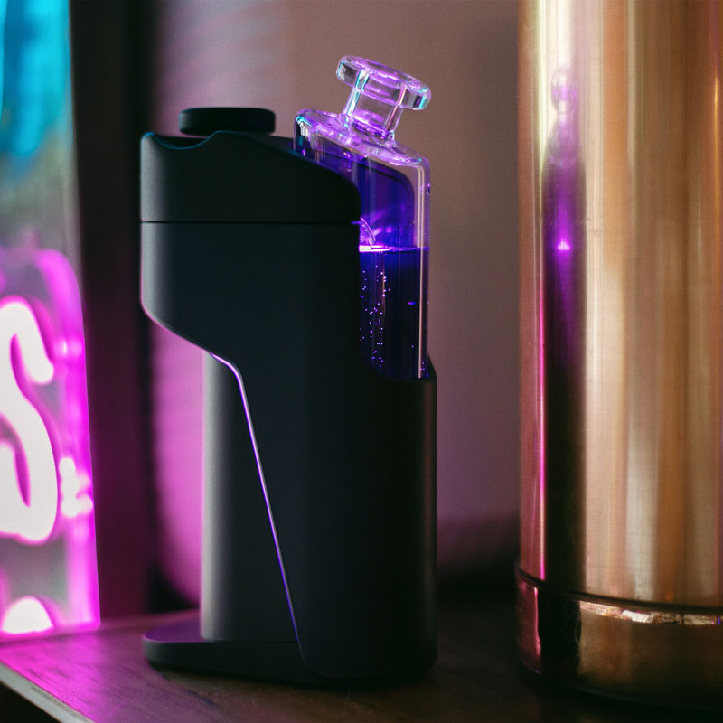 Side view of the Dr. Dabber Switch GO with illuminated glass water chamber