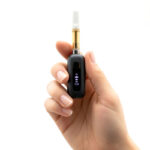 Black G Pen 510 OG battery with cartridge held in one hand