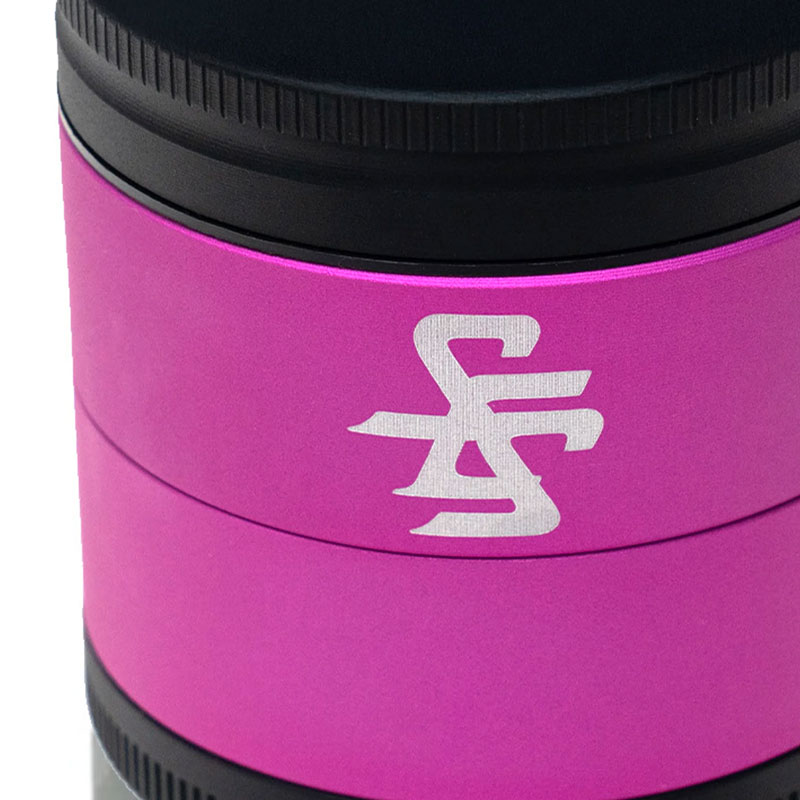 Close up of the Santa Cruz Shredder logo on the pink and black Split Series herb grinder