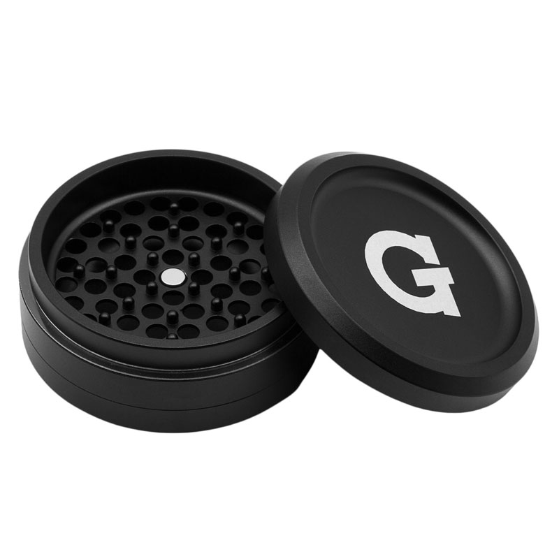 G Pen 3-Piece Slim Grinder open to show the grinding chamber and magnetic lid