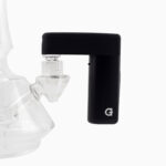 G Pen Micro 2 Vaporizer connected to a glass water pipe using the black rig adapter