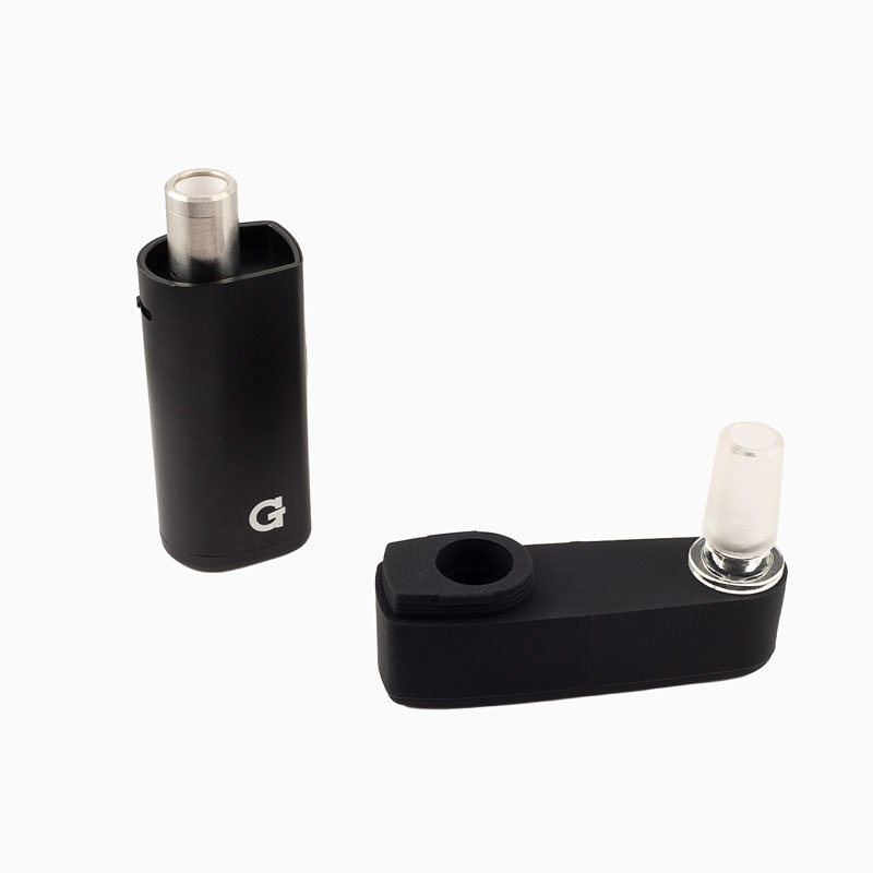 G Pen Micro 2 Vaporizer with ceramic tank exposed beside the black rig adapter and glass connector
