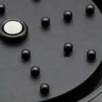 Close up of the G Pen Slim Grinder lid showing grinding pegs and magnetic centre