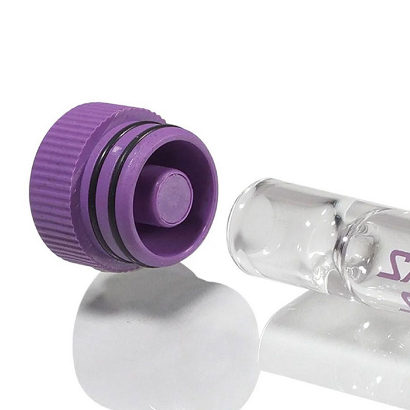 Close-up of purple Santa Cruz Shredder Hemp Dugout cap with dual sealing rings and built-in tamper beside glass one hitter