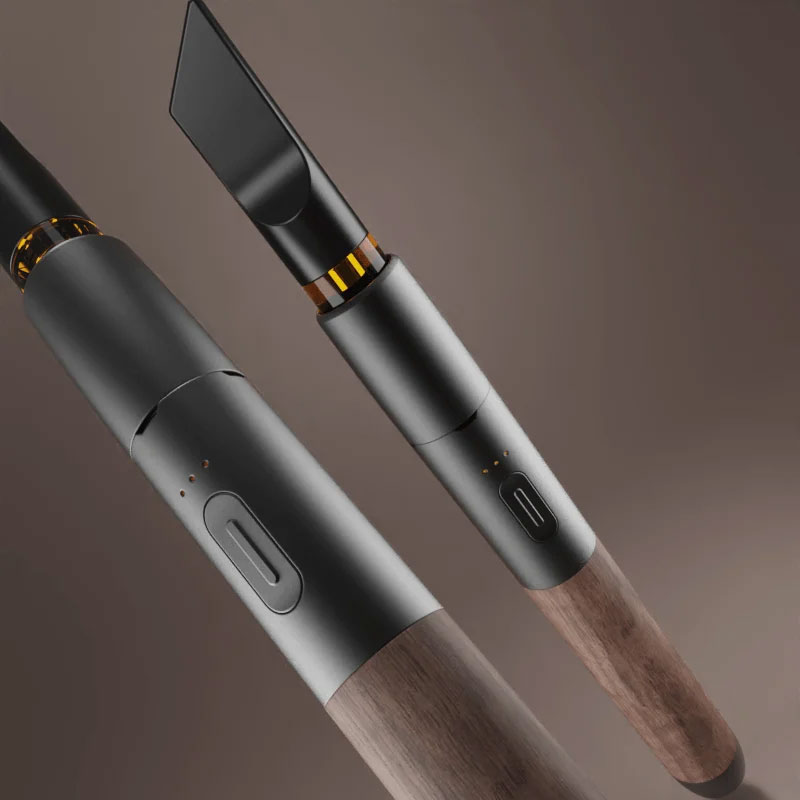 Two views of the Vessel Craftsman 510 Battery showing the walnut wood finish, metal body and cartridge connection