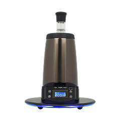 A sleek, metallic desktop vaporizer with a digital display on a black background.